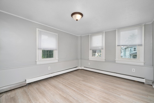74 Mill St, Middletown, CT 06457 - unfurnished room with wood finished floors, crown molding, baseboard heating, and a textured ceiling