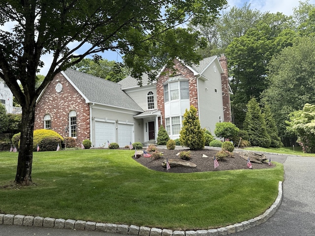 33 Alexandria Ct Unit 33, Fairfield, CT 06824 - traditional-style house featuring an attached garage, a front lawn, brick siding, a chimney, and roof with shingles