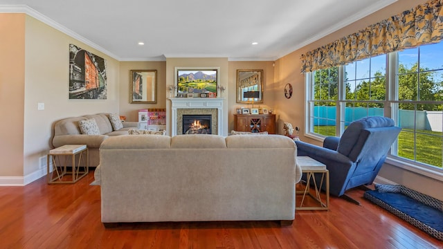 753 N Farms Rd, Wallingford, CT 06492 - living area with baseboards, wood finished floors, crown molding, recessed lighting, and a glass covered fireplace