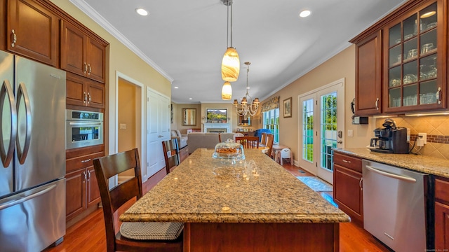 753 N Farms Rd, Wallingford, CT 06492 - kitchen with appliances with stainless steel finishes, recessed lighting, wood finished floors, tasteful backsplash, and crown molding