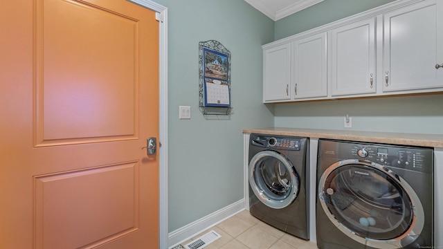 753 N Farms Rd, Wallingford, CT 06492 - laundry area featuring washing machine and clothes dryer, cabinet space, crown molding, baseboards, and light tile patterned floors