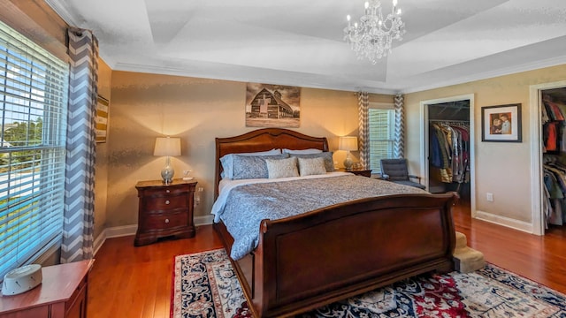 753 N Farms Rd, Wallingford, CT 06492 - bedroom featuring wood finished floors, multiple windows, a chandelier, and crown molding