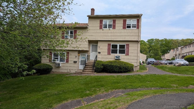 70 Lantern Park Dr Unit 1, Naugatuck, CT 06770 - tri-level home with a chimney and a front yard