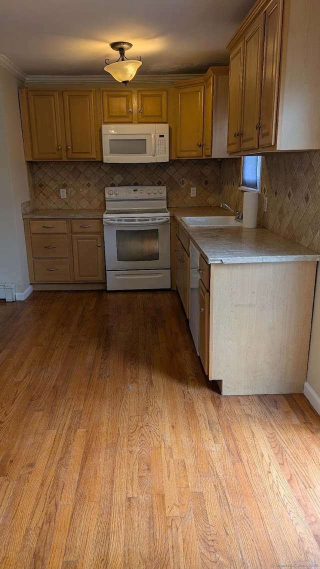 70 Lantern Park Dr Unit 1, Naugatuck, CT 06770 - kitchen with white appliances, a sink, backsplash, light countertops, and wood finished floors