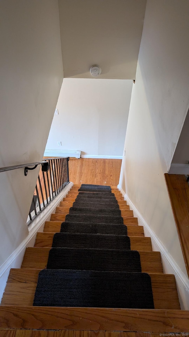 70 Lantern Park Dr Unit 1, Naugatuck, CT 06770 - staircase featuring baseboards and wood finished floors
