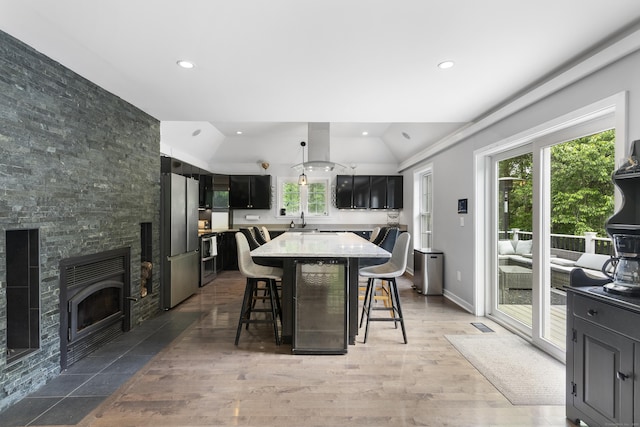 108 Hamburg Rd, Lyme, CT 06371 - dining room featuring vaulted ceiling, recessed lighting, a fireplace, and light wood-style flooring