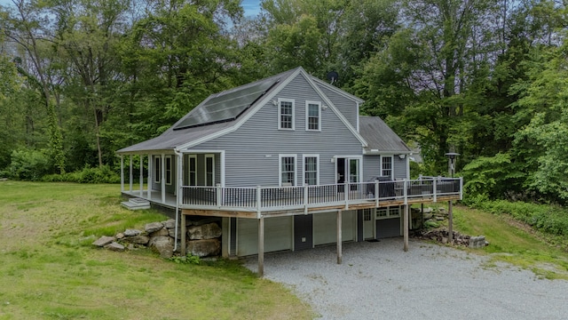 108 Hamburg Rd, Lyme, CT 06371 - rear view of property with gravel driveway, a wooden deck, a garage, a yard, and a shingled roof