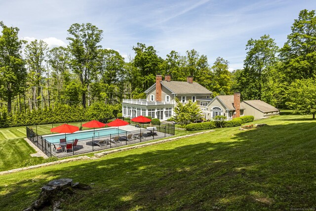 354 Rte 7 N, Canaan, CT 06031 - rear view of house featuring a patio area, a chimney, and view of wooded area