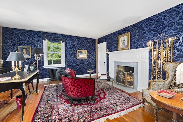 354 Rte 7 N, Canaan, CT 06031 - living area with wallpapered walls, wood-type flooring, and a fireplace with flush hearth
