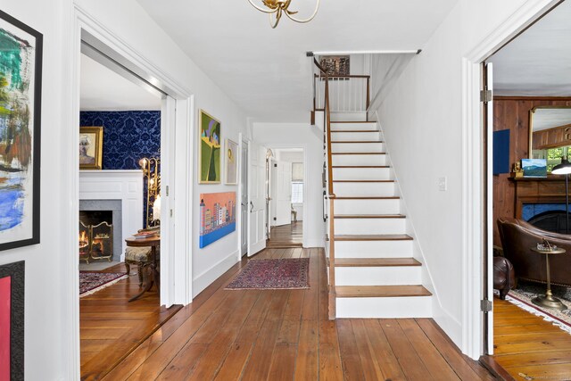 354 Rte 7 N, Canaan, CT 06031 - stairway featuring a premium fireplace, wood-type flooring, and baseboards