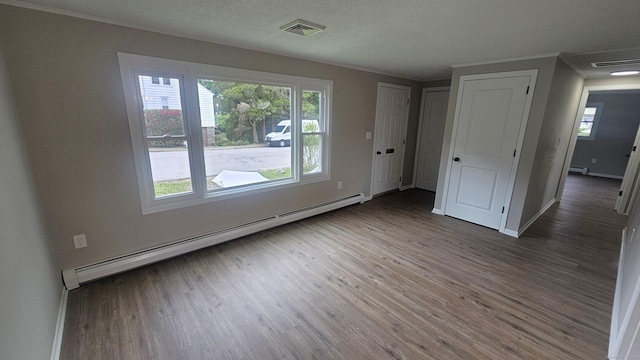 3 Norwood Ave, New London, CT 06320 - spare room with baseboard heating, wood finished floors, crown molding, and plenty of natural light