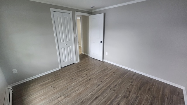 3 Norwood Ave, New London, CT 06320 - unfurnished bedroom with baseboard heating, ornamental molding, wood finished floors, a closet, and baseboards