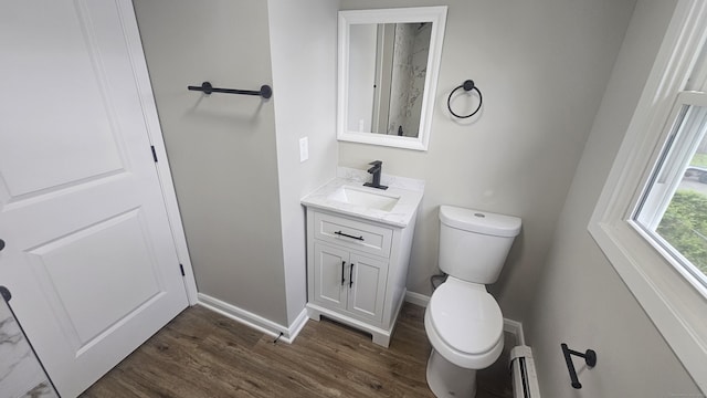 3 Norwood Ave, New London, CT 06320 - bathroom featuring toilet, wood finished floors, vanity, and baseboards