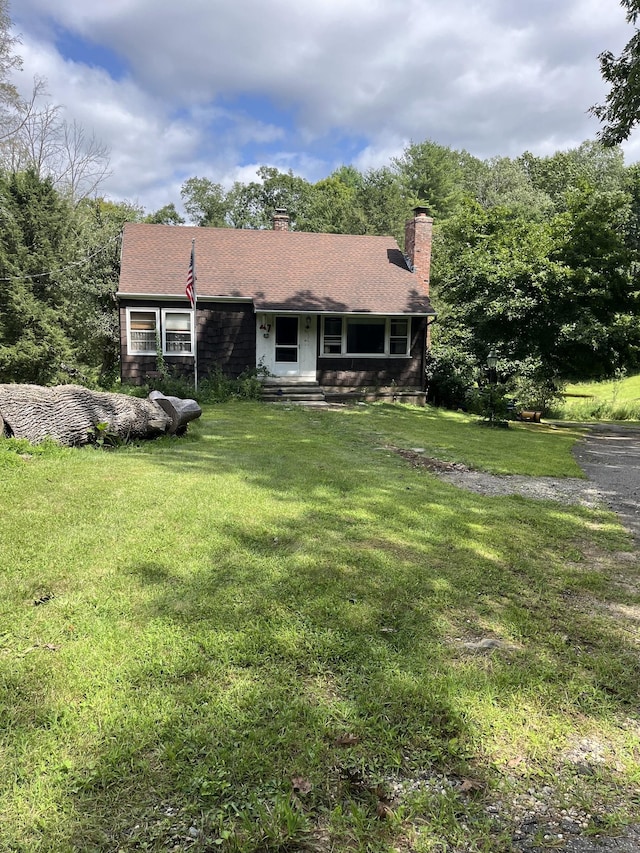 47 Devaux Rd, Torrington, CT 06790 - back of property featuring a yard and a chimney