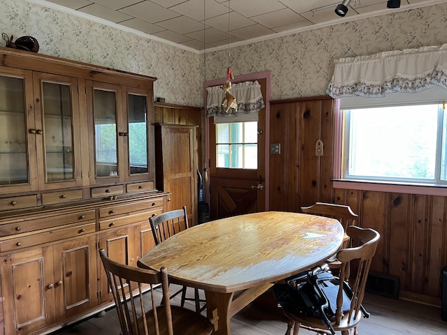 47 Devaux Rd, Torrington, CT 06790 - dining room with wallpapered walls, ornamental molding, dark wood-style floors, and wood walls