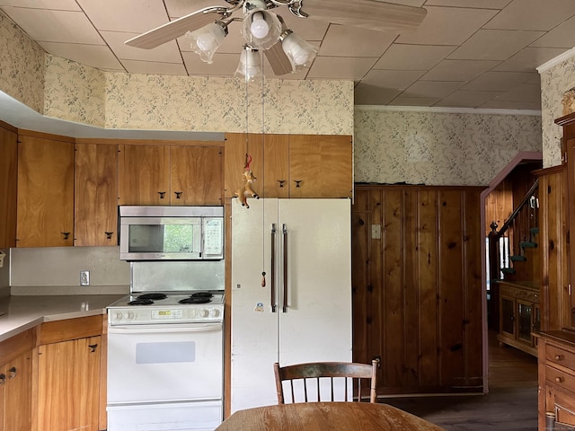 47 Devaux Rd, Torrington, CT 06790 - kitchen with white appliances, wallpapered walls, ceiling fan, wood finished floors, and light countertops