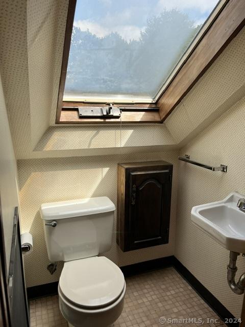 47 Devaux Rd, Torrington, CT 06790 - bathroom with toilet, a sink, baseboards, and wallpapered walls