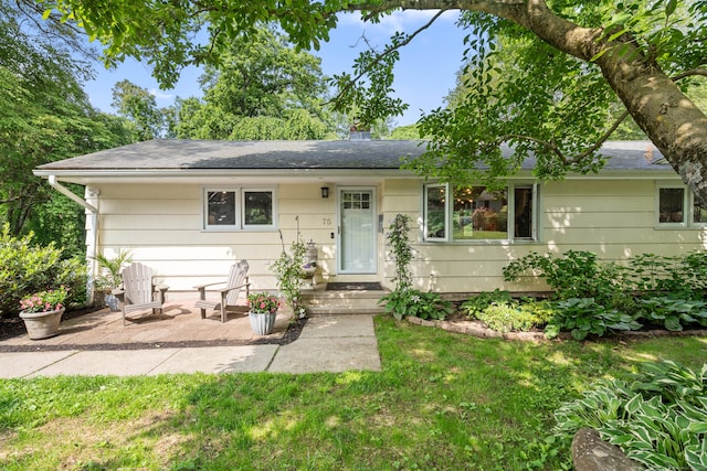 75 Skyview Dr, Trumbull, CT 06611 - view of front facade featuring a patio, a front lawn, and roof with shingles