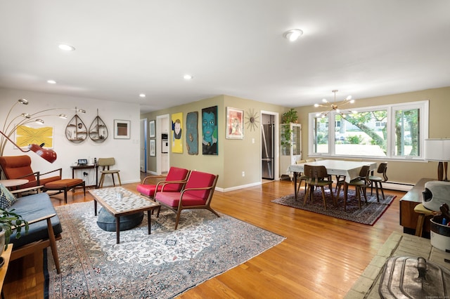 75 Skyview Dr, Trumbull, CT 06611 - living area with light wood-style flooring, recessed lighting, a chandelier, baseboards, and baseboard heating