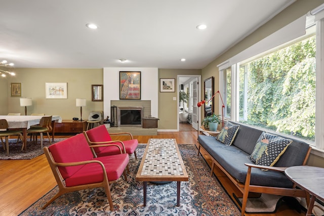 75 Skyview Dr, Trumbull, CT 06611 - living room featuring wood finished floors, recessed lighting, a glass covered fireplace, and a chandelier