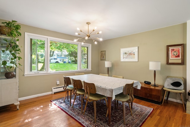 75 Skyview Dr, Trumbull, CT 06611 - dining space featuring a chandelier, a baseboard radiator, baseboards, and light wood-style floors