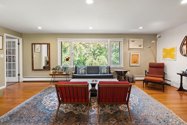 75 Skyview Dr, Trumbull, CT 06611 - living room featuring a baseboard heating unit, recessed lighting, wood finished floors, and a baseboard radiator