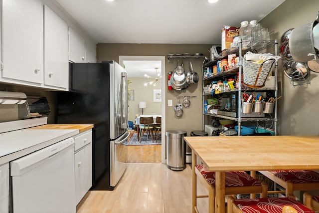 75 Skyview Dr, Trumbull, CT 06611 - kitchen featuring white dishwasher, wood counters, light wood-type flooring, and white cabinets