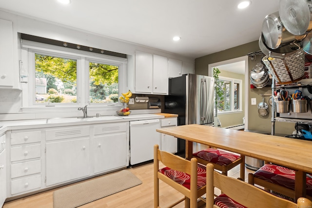 75 Skyview Dr, Trumbull, CT 06611 - kitchen with dishwasher, a sink, light countertops, plenty of natural light, and recessed lighting