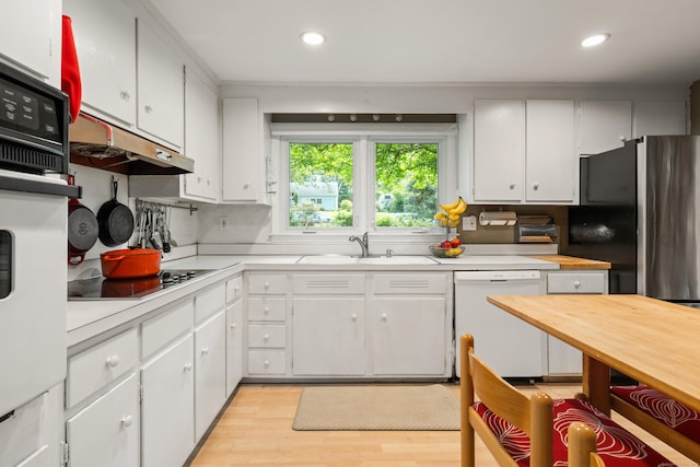 75 Skyview Dr, Trumbull, CT 06611 - kitchen featuring white appliances, light countertops, light wood-style floors, white cabinets, and recessed lighting