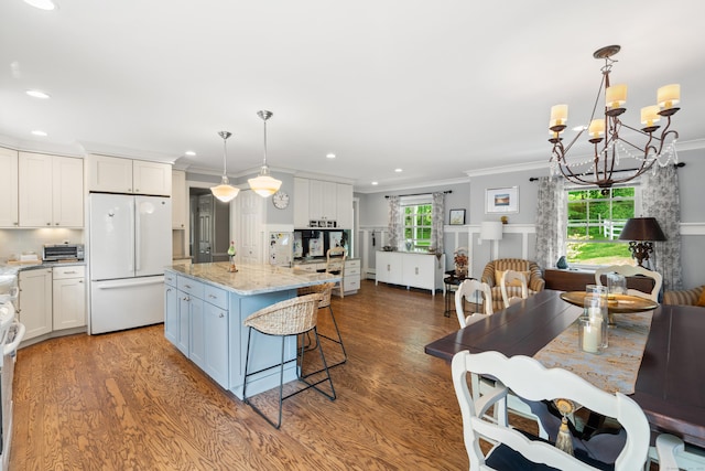 33 Crestview Dr, Brookfield, CT 06804 - kitchen with freestanding refrigerator, wood finished floors, ornamental molding, white cabinets, and a kitchen island