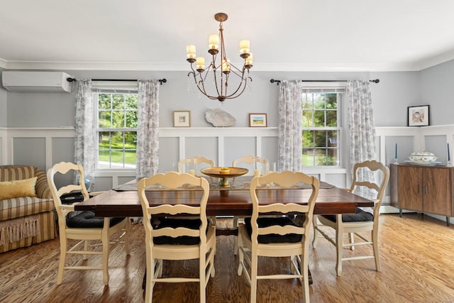 33 Crestview Dr, Brookfield, CT 06804 - dining space with a decorative wall, a wall unit AC, a chandelier, plenty of natural light, and wood finished floors