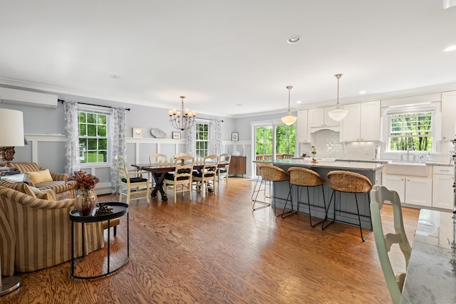33 Crestview Dr, Brookfield, CT 06804 - living area with healthy amount of natural light, crown molding, light wood-style floors, a chandelier, and recessed lighting