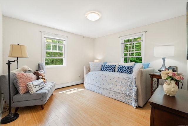 33 Crestview Dr, Brookfield, CT 06804 - bedroom with a baseboard heating unit, light wood-style flooring, and baseboards