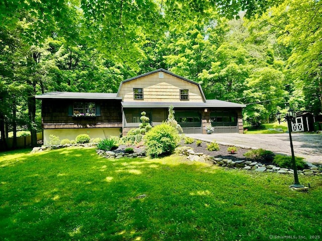 687 Sprout Brook Rd, Putnam Valley, NY 10579 - view of front of home featuring a front lawn, driveway, and a gambrel roof