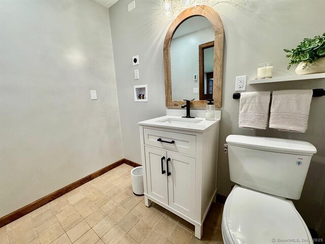 687 Sprout Brook Rd, Putnam Valley, NY 10579 - half bath featuring toilet, baseboards, and vanity