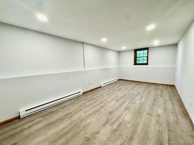 687 Sprout Brook Rd, Putnam Valley, NY 10579 - unfurnished room featuring a baseboard heating unit, wood finished floors, baseboards, and recessed lighting