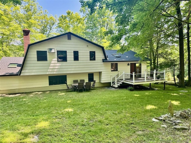687 Sprout Brook Rd, Putnam Valley, NY 10579 - back of house with a deck, a shingled roof, a chimney, a lawn, and a gambrel roof