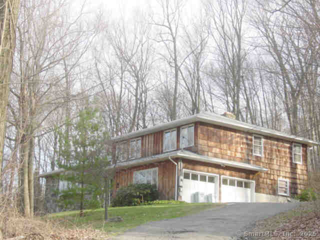 14 Old Bridge Rd W, New Fairfield, CT 06812 - view of front of house with an attached garage and asphalt driveway