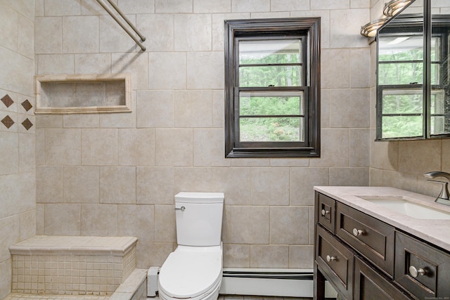 14 Old Bridge Rd W, New Fairfield, CT 06812 - bathroom with a baseboard heating unit, vanity, tile walls, toilet, and healthy amount of natural light