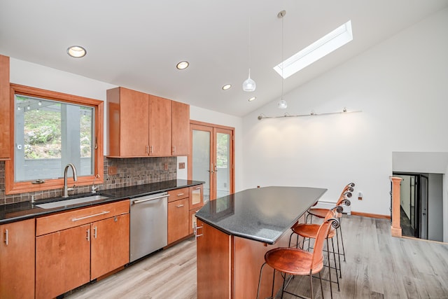 14 Old Bridge Rd W, New Fairfield, CT 06812 - kitchen with dishwasher, a skylight, light wood-type flooring, a sink, and backsplash