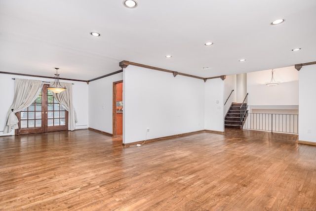 14 Old Bridge Rd W, New Fairfield, CT 06812 - unfurnished living room with ornamental molding, recessed lighting, stairway, light wood-type flooring, and baseboards