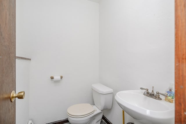 14 Old Bridge Rd W, New Fairfield, CT 06812 - half bath featuring toilet, a sink, and baseboards