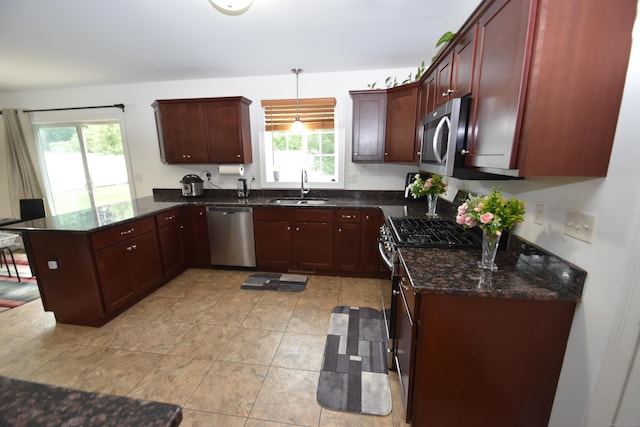 5 Old Village Cir, Windsor, CT 06095 - kitchen with stainless steel appliances, a sink, a peninsula, dark brown cabinets, and dark stone counters