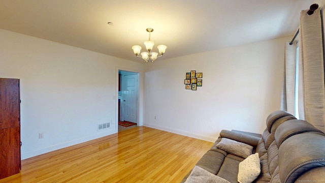 5 Old Village Cir, Windsor, CT 06095 - sitting room with a chandelier, light wood-type flooring, and baseboards
