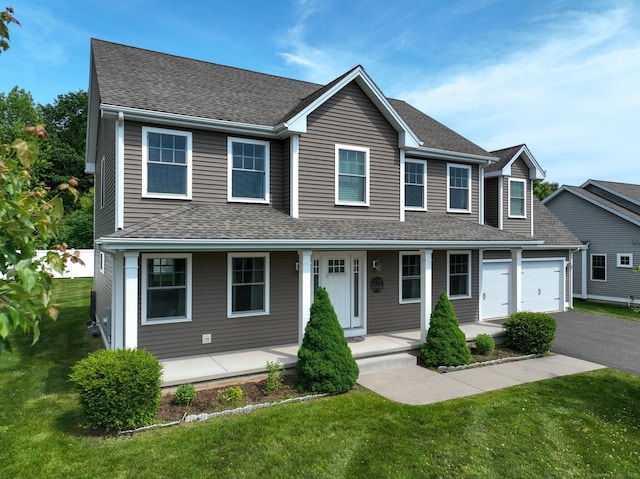 5 Old Village Cir, Windsor, CT 06095 - view of front of home with a porch, an attached garage, a shingled roof, driveway, and a front yard