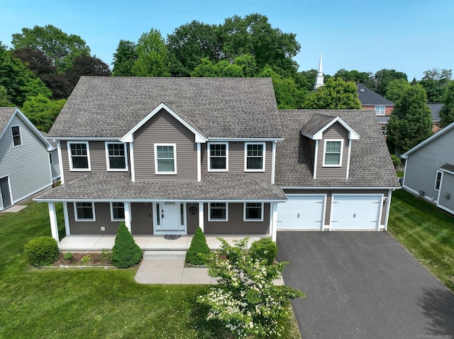 5 Old Village Cir, Windsor, CT 06095 - view of front of house with a shingled roof, asphalt driveway, covered porch, and a front lawn