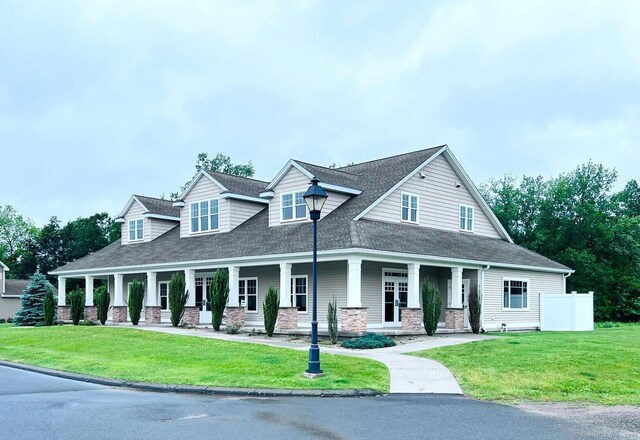5 Old Village Cir, Windsor, CT 06095 - view of front of home with a porch, a front lawn, and roof with shingles