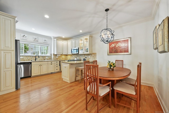 43 Harold St Unit B, Greenwich, CT 06807 - dining area with crown molding, light wood-style flooring, a chandelier, recessed lighting, and baseboards