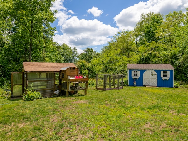 93 Kent Rd, Wilton, CT 06897 - view of green lawn featuring exterior structure and a garden