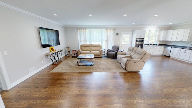 435 Maple Ave, Cheshire, CT 06410 - living room with wood finished floors, crown molding, and recessed lighting